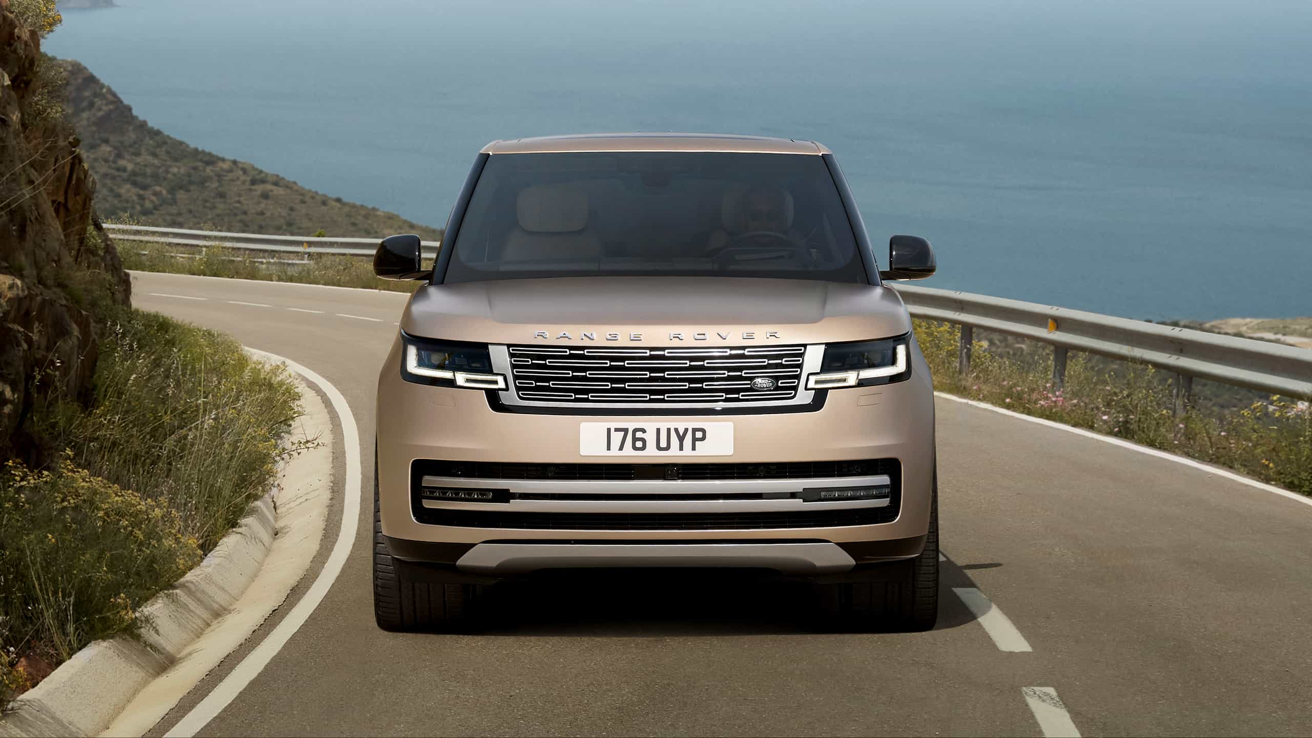 New Range Rover climbing on mountain road