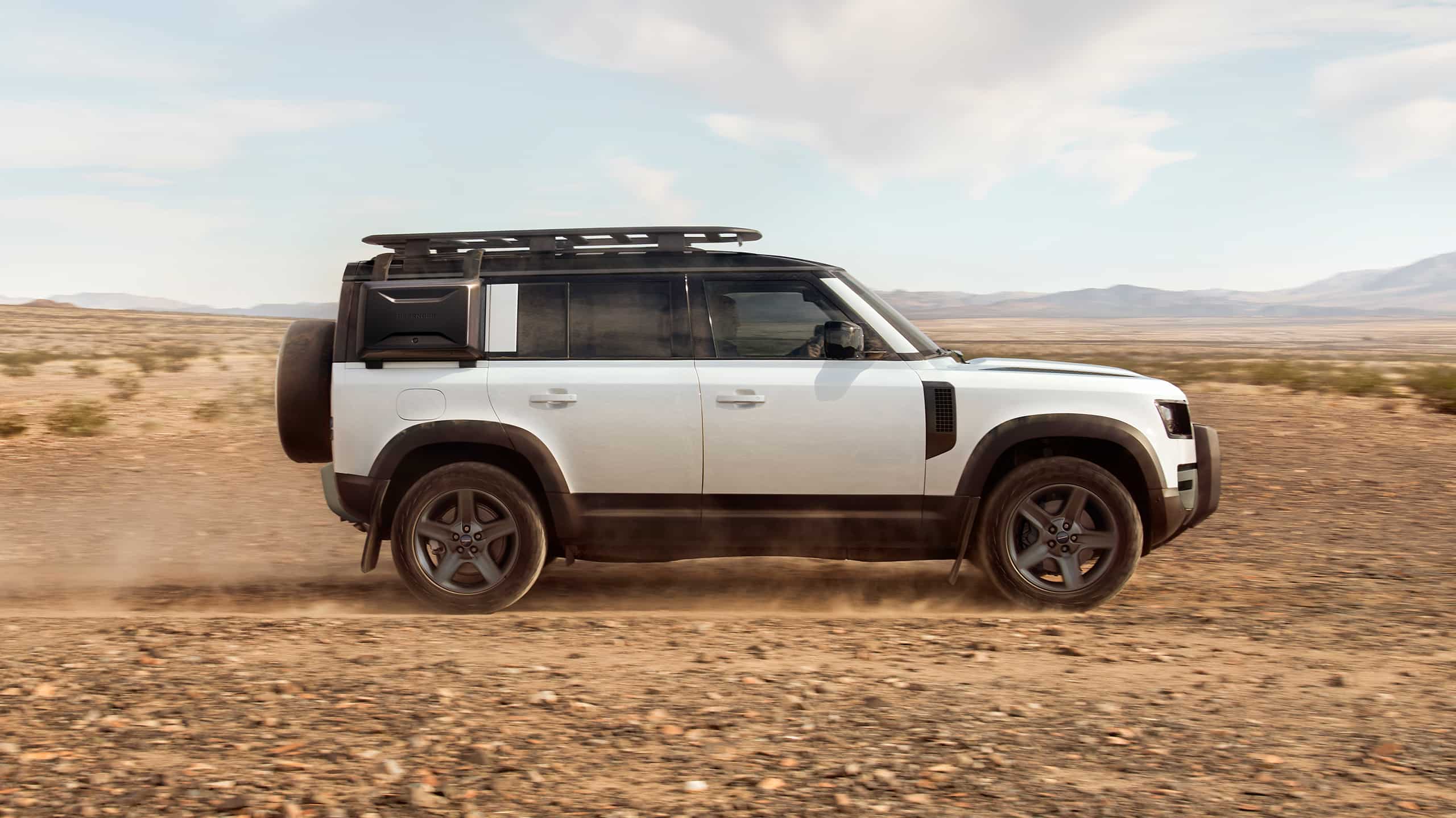 Defender driving on road
