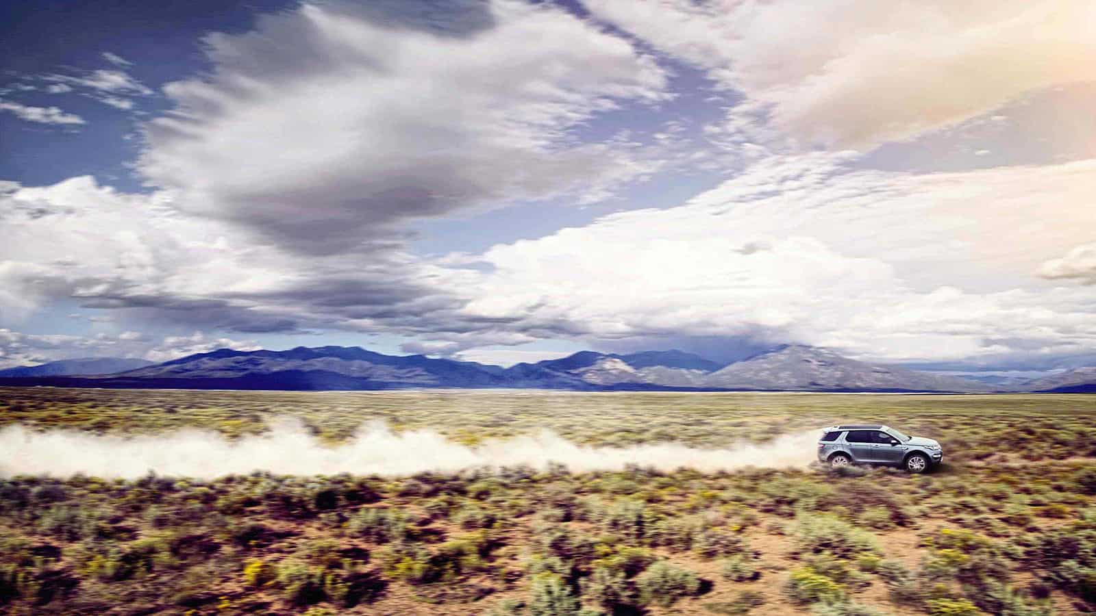 Discovery Sport driving through a desert